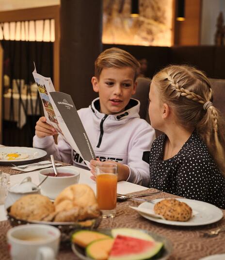children at breakfast on a family holiday