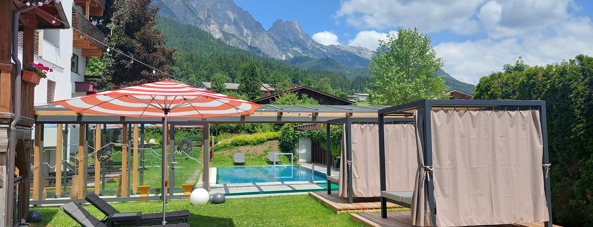 Garden with pool and sun loungers for relaxing