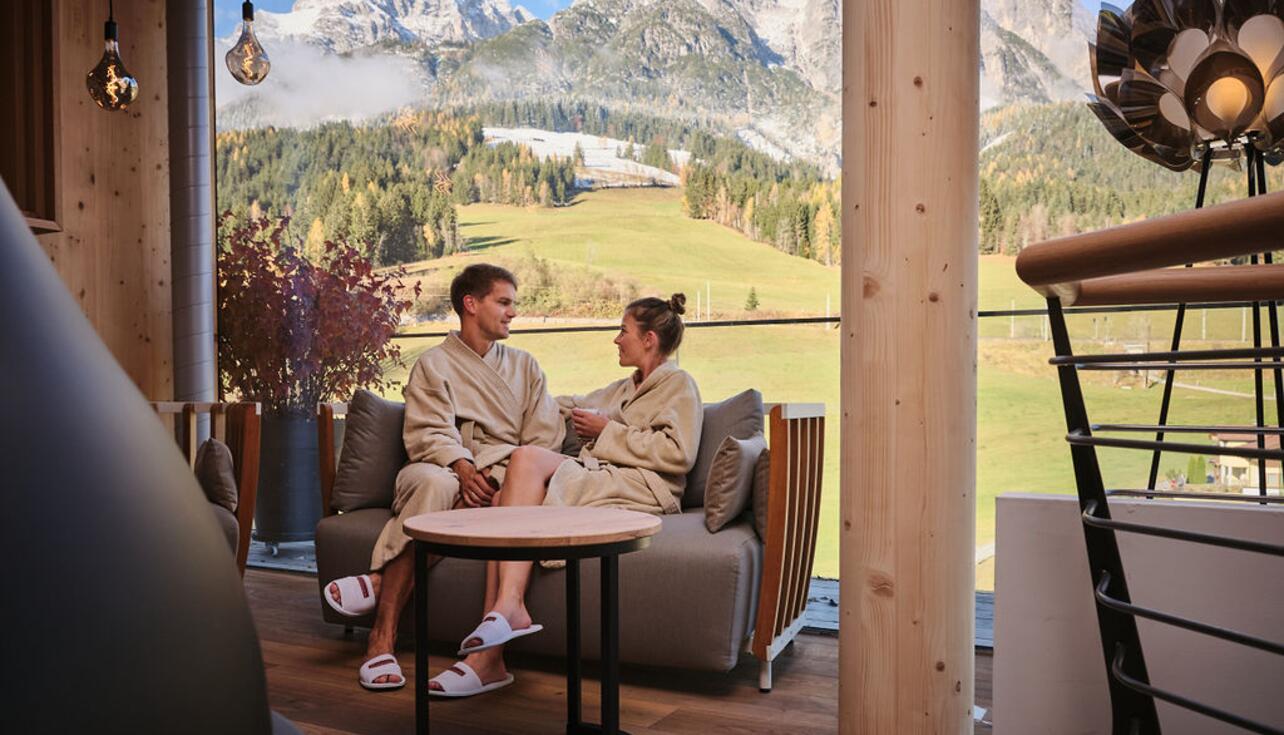 Couple drinks tea in the relaxation area with a view
