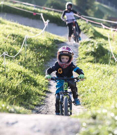 child on mountain bike holiday