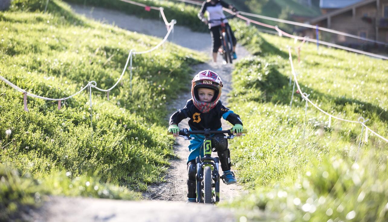 child on mountain bike holiday