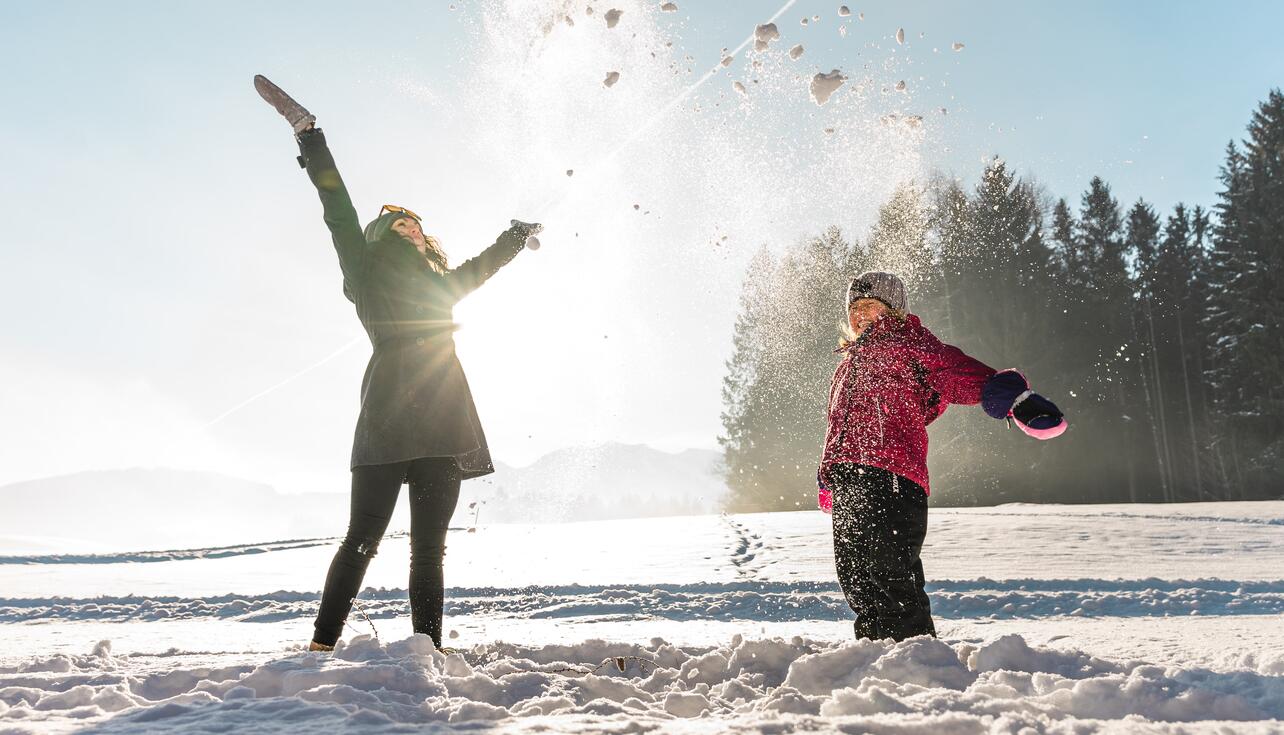 mother with child in the snow